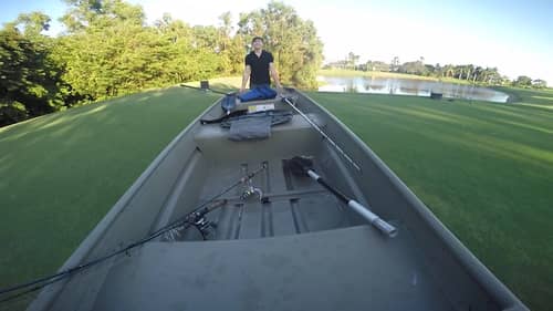 Carrying a Jon Boat Across a Golf Course to Catch Bass