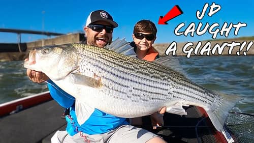 8 Year Old Kid Catches MASSIVE Fish!!! GIANT Striped Bass!!!