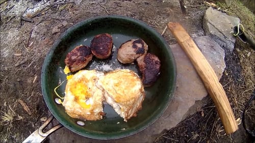 Finishing up Log Fence at the Cabin, cooking eggs and sausage over Fire
