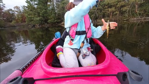 Perch fishing from her fishing kayak