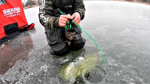 Catching His BIGGEST Bass EVER!!! (Crazy Clear Ice)
