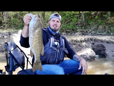 FISHING MUDDY BLOWN OUT RIVER PAYS OFF 'BIG TIME'