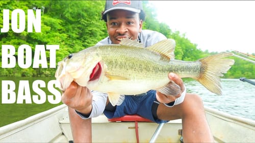 MY BIGGEST JON BOAT BASS EVER (CRAZY TOPWATER BLOWUP)