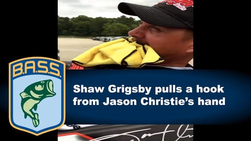 Shaw Grigsby removes hook from Jason Christie's hand
